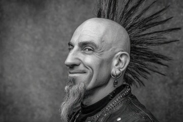 Smiling Punk Rocker with Mohawk and Goatee in Black and White.
