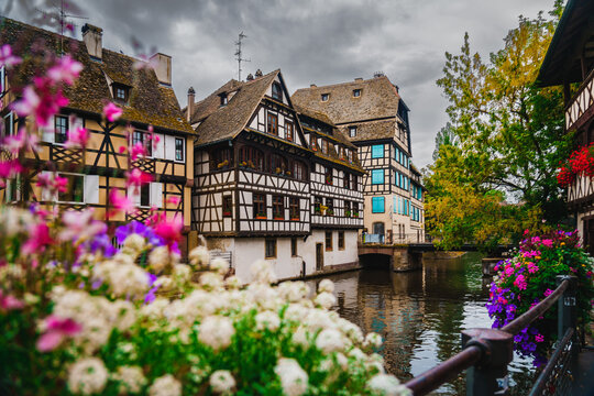 Scenic Panorama of Strasbourg Canals with flowers and traditional architecture and Half-Timbered Houses