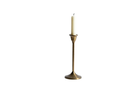 An elegant golden candlestick holds a single, unlit, cream-colored taper candle