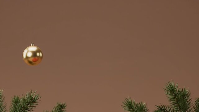 Golden Christmas Ornament Hangs Near Pine Branches on Brown Background.