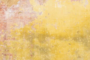 Weathered yellow wall showing signs of age and decay