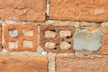 Close up of textured brick wall showing different construction techniques
