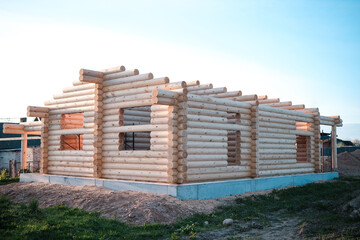 Construction of a house from rounded logs