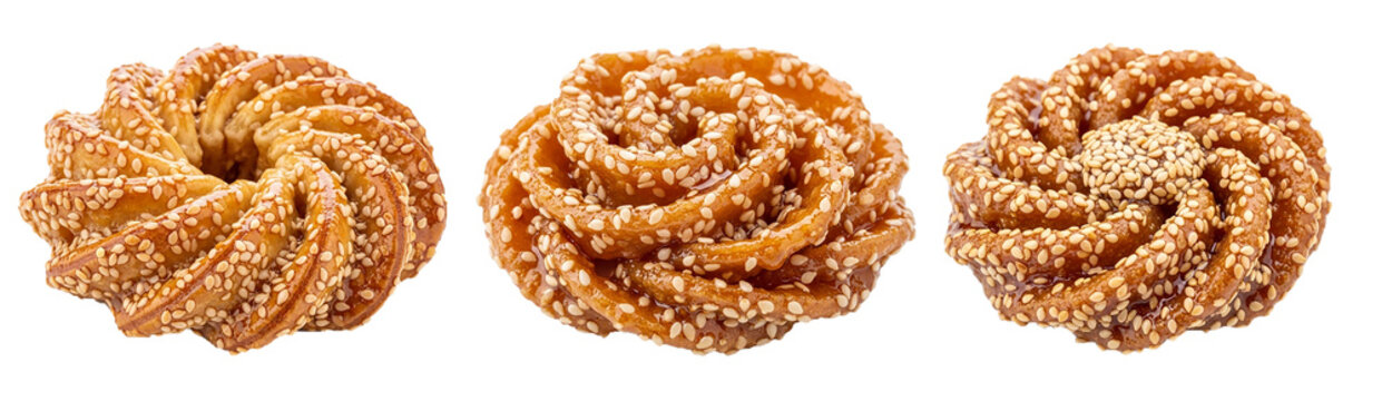 Traditional Moroccan chebakia cookie, flower-shaped and coated in honey and sesame, on a plate PNG