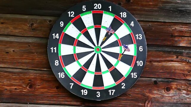 Playing darts, darts fly right to the target