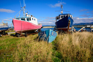 Once proud inshore fishing boats sit in cradles onshore at the harbour in Cow Head, a community inside Gros Mourne National Park on the west coast of Newfoundland 