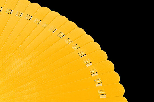 A yellow object with a black background