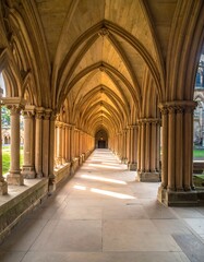 Sunlit arched cloister walkway