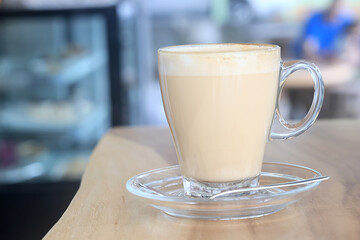 cappuccino, coffee in a clear glass cup in a cafe, soft color background food and drink, hot drink