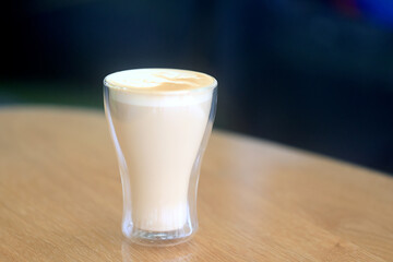 cappuccino, coffee in a clear glass cup in a cafe, soft color background food and drink, hot drink