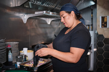 Chef preparing food in professional restaurant kitchen