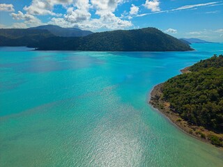 Fototapeta premium Aerial Drone View of Tropical Queensland Beach, Ocean Waves, Island Coastline and Shoreline - Scenic Coastal Landscape, Clear Blue Water, Australia Nature, Travel, Tourism, QLD