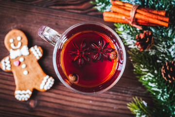 cup with christmas mulled wine on wooden background top view