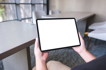 Mockup image of a woman holding digital tablet with blank white desktop screen