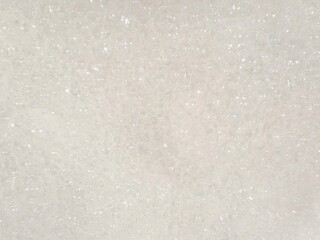 Foam background texture in water. Relaxing atmosphere of bath bubbles. Abstract white soapy foam surface in close-up