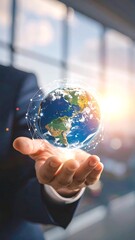 A hand holds a digital globe, suggesting global connectivity