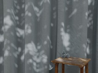 Rustic wooden table with pine cones in front of slate blue curtain, natural sunlight shadow interior background mockup