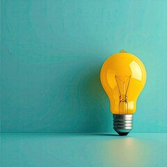 Single yellow lightbulb on teal background