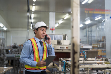 Male engineer, Industry factory. Asian male plant engineer working and checking operation of production system at industry factory