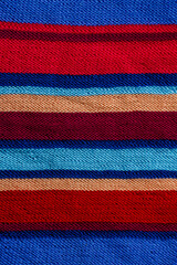 Knitted striped fabric texture, multicolor handmade textile background, stylish autumn winter clothing
