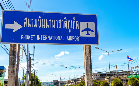 Traffic road sign to Phuket International Airport in Thailand.