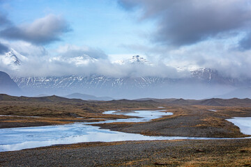 Rugged Icelandic Landscape with only a small amount of  snow and ice.