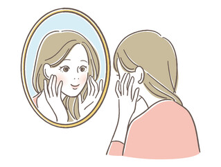 鏡を見つめる女性