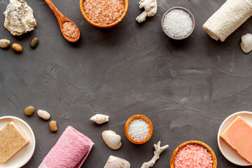 Essential oil in bottles and spa cosmetics with towels, top view. Beauty spa therapy cosmetics and wellness flat lay