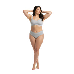 Fototapeta premium Confident plus size woman posing in comfortable loungewear against a clear expanse