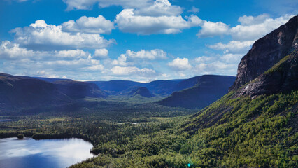 A beautiful mountain range with a lake in the foreground