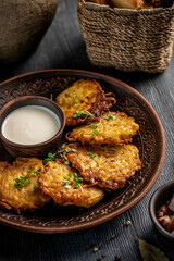 Crispy potato pancakes with sour cream dip