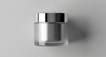 A frosted glass jar with a silver lid, isolated on a white background, perfect for cosmetic or skincare product packaging