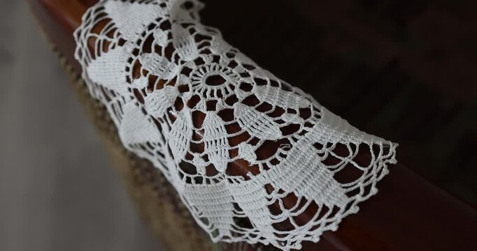 Shallow depth of field (selective focus) details with Romanian communist era Milieu (Mileu or macrame) decoration.