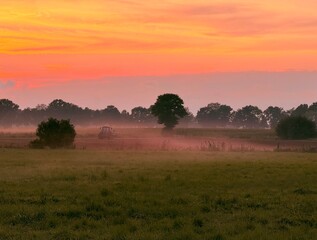 fantastic colorful sky after the sunset, fog at the field, countryside fantastic purple evening