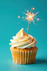 Miniature cupcake with gold sparkler, vibrant blue backdrop, food, homebaking