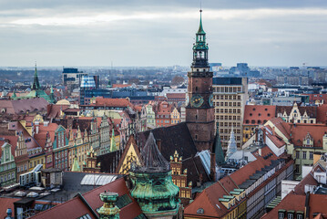 Fototapeta premium Aerial view from so called Witches Bridge of Saint Mary Magdalene church on old town hall in historic part of Wroclaw city, Poland