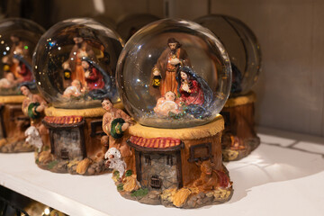 A glass balls with the Scene of the birth of Jesus Christ with Mary and Joseph