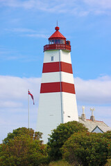 Alnes lighthouse, Alnes island, Norway. It was established in 1852 to guide fishing boats safely to...