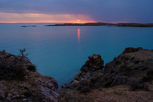 Sunset over Lake Balkhash in Kazakhstan with turquoise water on an autumn evening