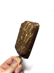 Dubai chocolate ice cream, ice cream on a stick. Ice cream copy space, top view, flat lay. High quality