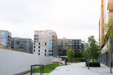 Construction of modern residential apartment buildings in an urban area.