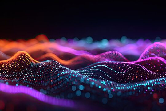 Abstract depiction of undulating waves constructed of glowing, colorful particles in a dark void