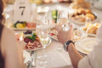 Elegant dining experience at a beautifully arranged table filled with delicious food and sparkling glasses during a cheerful gathering