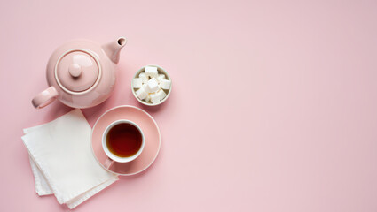 Aesthetic Tea Time Still Life with Pink Teapot Cup Sugar Cubes and White Napkins on a Light Pink Surface A Charming Scene for a Relaxing Afternoon Break