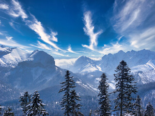 clouds over the snow-covered mountain peaks