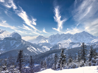 Fototapeta premium clouds over the snow-covered mountain peaks