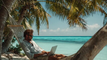 A man works remotely on his laptop while relaxing in a hammock on a beautiful beach - Powered by Adobe
