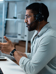 Male Call Center Customer Service Agent with Headset at Office Computer, Professional Operator Providing Helpline Support, CRM Consultation, Telemarketing and Remote Online Communication with Clients.