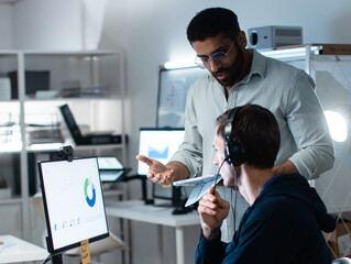 Corporate Call Center Staff Collaborating on Customer Support Feedback, Collaborating, Sharing Advice, and Planning Client Support Strategy at Call Center office. Solutions and Team Development.