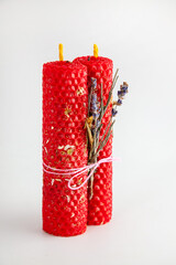 Red herbal magic candles with lavender and artemisia for rituals and home decoration